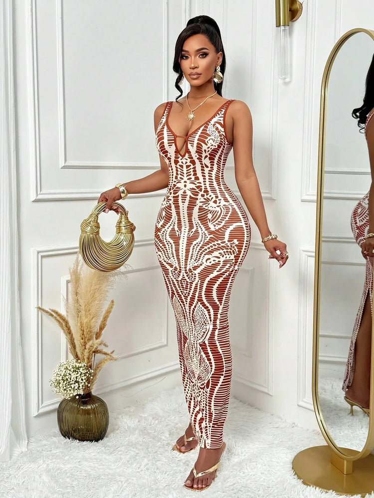 Woman in a patterned dress standing in a stylish room with decor elements.