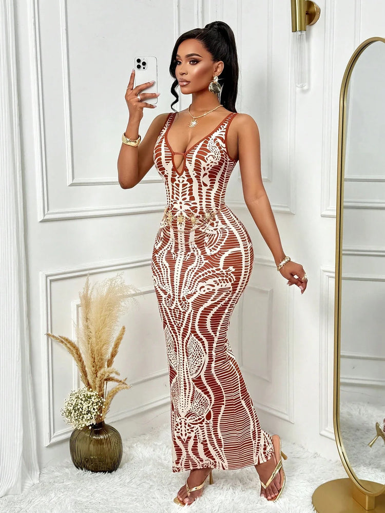 Woman taking a selfie in a patterned dress in a stylish room.