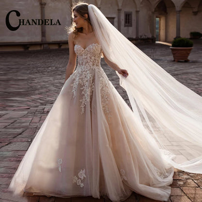 CHANDELA Breathtaking Strapless Wedding Dress. Stunning Lace Appliques and Flowy Bridal Dress.