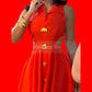 Red dress with gold buttons worn by a person, with &
